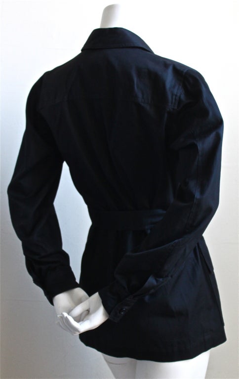 Black safari jacket from Yves Saint Laurent dating to 1969. Labeled a French 38, however this jacket best fits a US 4 or 6. Unlined. Approximate measurements: bust: 36