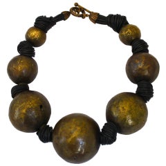 handmade oversized bronze necklace strung on leather 5