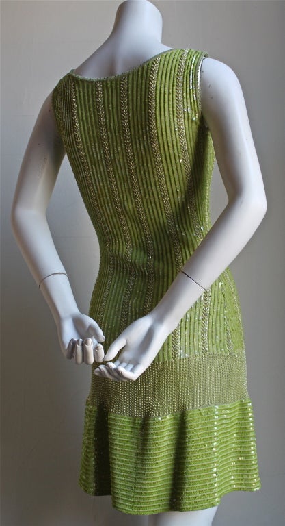 Chartreuse green beaded minidress from Azzedine Alaia dating to the early 1990's. Dress is labeled a size S. Slips on over the head. Made in Italy. Excellent, unworn condition.