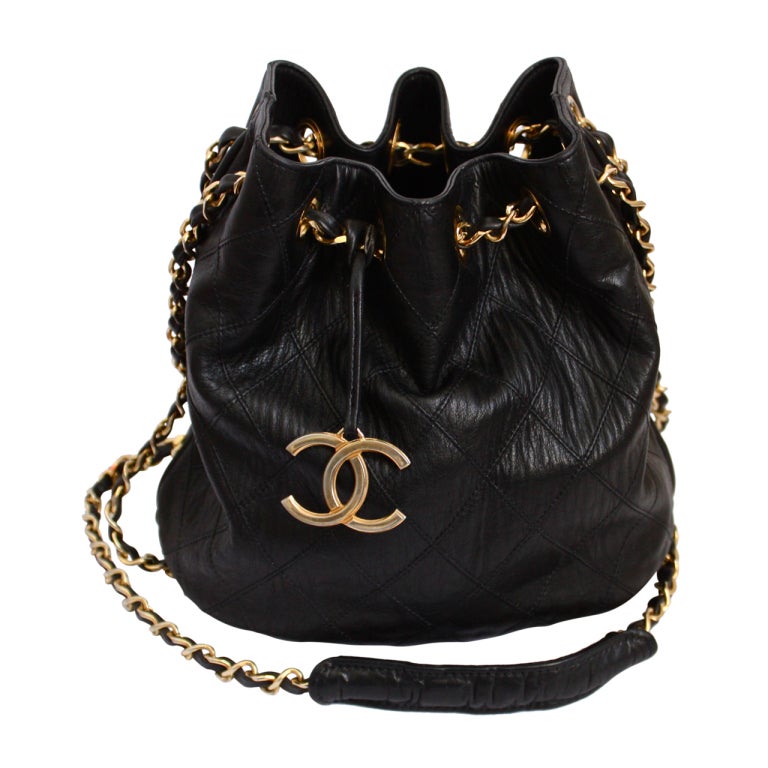1980's CHANEL black quilted leather bucket bag with gilt chain at