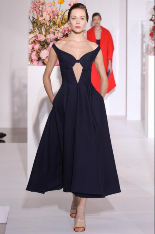 Amazing navy blue wool and silk gown with intricate seaming and sheer paneling at bodice designed by Raf Simons for his last collection at Jill Sander. Size 36 which best fits a 4. Fully lined. Side zip entry. Made in Italy. Excellent unworn