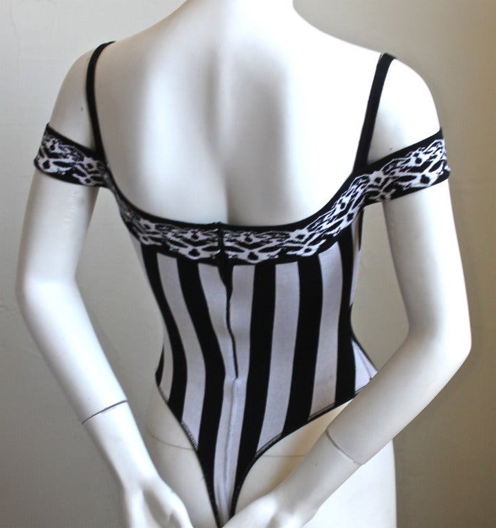 Very rare black and white striped bodysuit designed by Azzedine Alaia dating to 1991. Labeled a size XS. Un-stretched measurements: bust 26