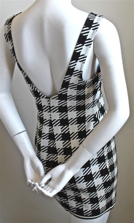 Very rare black and white oversized houndstooth Alaia dress from the 'Tati' collection dating to 1991. Best fits a size S/M (no size indicated). Dress (un-stretched) measures approximately 32