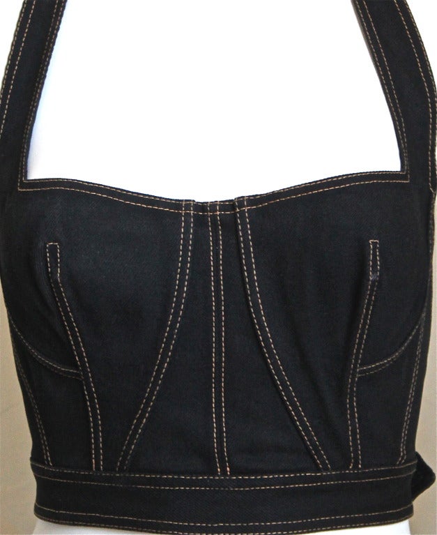 Black denim bustier halter top with gold topstiching and back buckle from Azzedine Alaia dating to 1991. Fits a size XS or S. Made in France. Very good condition.