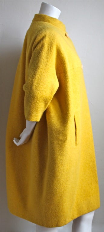 Vibrant yellow fuzzy wool haute couture coat from Cristobal Balenciaga for his Spanish couture house EISA dating to the early 1960's.  Fits various sizes due to the cocoon like shape. Approximate bust measurement is 26