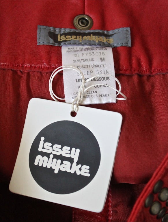 Women's 1980's ISSEY MIYAKE red leather mini skirt with oversized studs