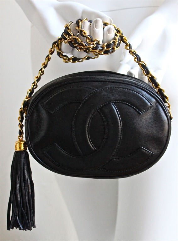 1980's CHANEL oval black leather 'CC' bag with gilt chain at 1stDibs