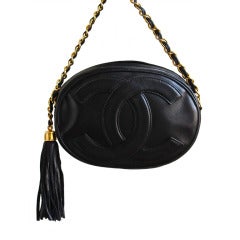 1980's CHANEL oval black leather 'CC' bag with gilt chain