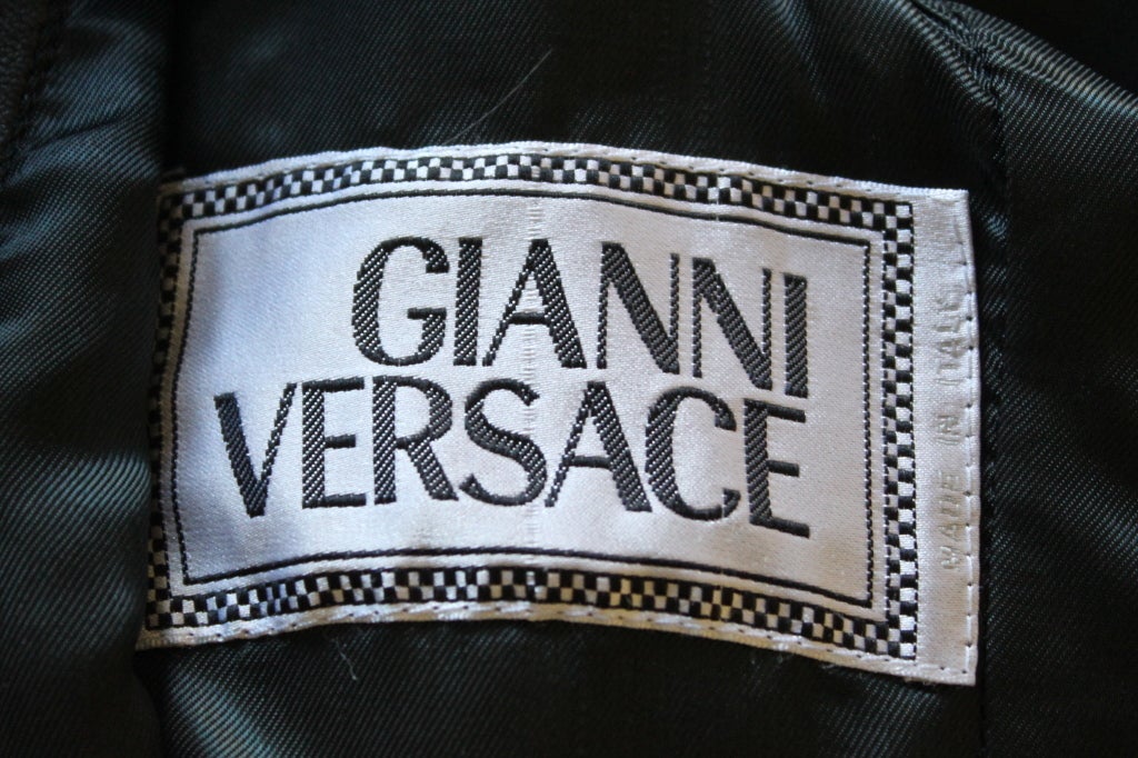 Women's rare GIANNI VERSACE black leather jacket with safety pins 1994