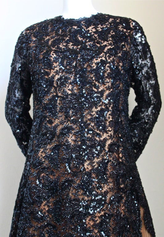 Very rare jet black lace haute couture dress with sequins and blush pleated silk underlay from Cristobal Balenciaga for his Eisa boutique dating to the early 1960's. Fits a size 6-10. Approximate measurements: shoulders along top 17