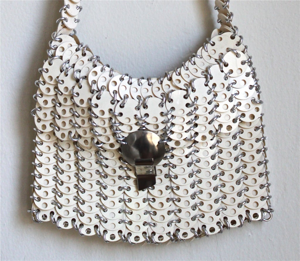Very rare cream disc shoulder bag with silver hardware from Paco Rabanne dating to the 1960's. Bag measures 9