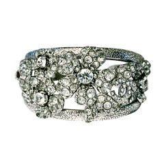 CHANEL floral cuff bracelet with 'CC' and crystals