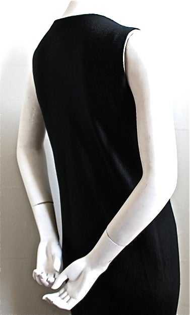 Beautiful textured black silk bias cut gown from Halston dating to the 1970's. Fits a size 4-8. Slips on over the head. Fully lined. Made in U.S. Excellent condition.