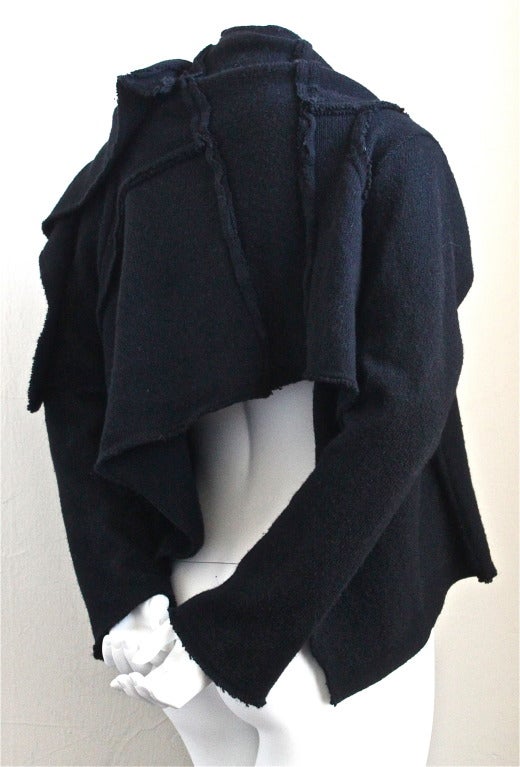 Black COMME DES GARCONS asymmetrical black wool wrap sweater with raw edges