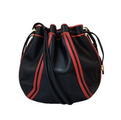 1970's GUCCI black and red leather cinch bag with gilt hardware