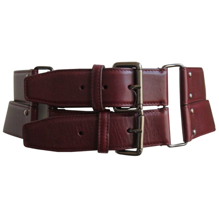unworn AZZEDINE ALAIA burgundy belt with double buckle closure and brass hardware