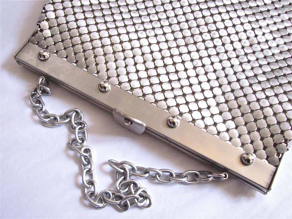 Beautiful brushed aluminum mesh bag from Whiting and Davis. Great round stud detail on frame. Unique latch closure.  Bag measures 11.5