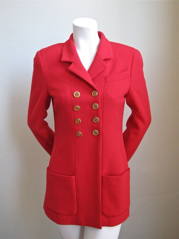 Gorgeous structured red wool jacket from Chanel. 1993. Size 36. Fits a US 2/4. Pockets at hips. Vents at sides. Fully lined in silk 'CC' fabric. Made in France. Excellent condition. Featured in the March 1993 issue of Vogue.