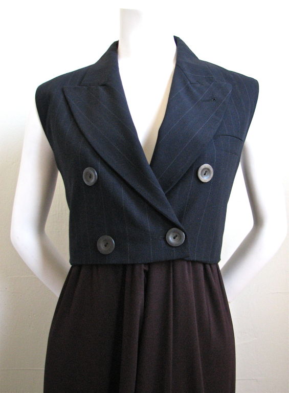 Beautiful menswear styled dress from Jean Paul Gaultier dating to the 1990's. Dress is made of a navy and white fine pinstriped 'blazer' with brown skirting. Hidden pockets at hips. Labeled a French 42, which fits a US 8-10. Made in France.