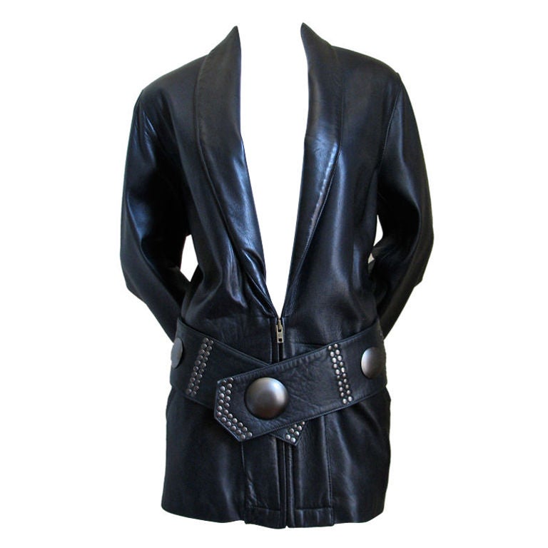 Jet black butter soft leather jacket with pewter-toned studs from Issey Miyake dating to the 1980's. Labeled a size M. Bust 38