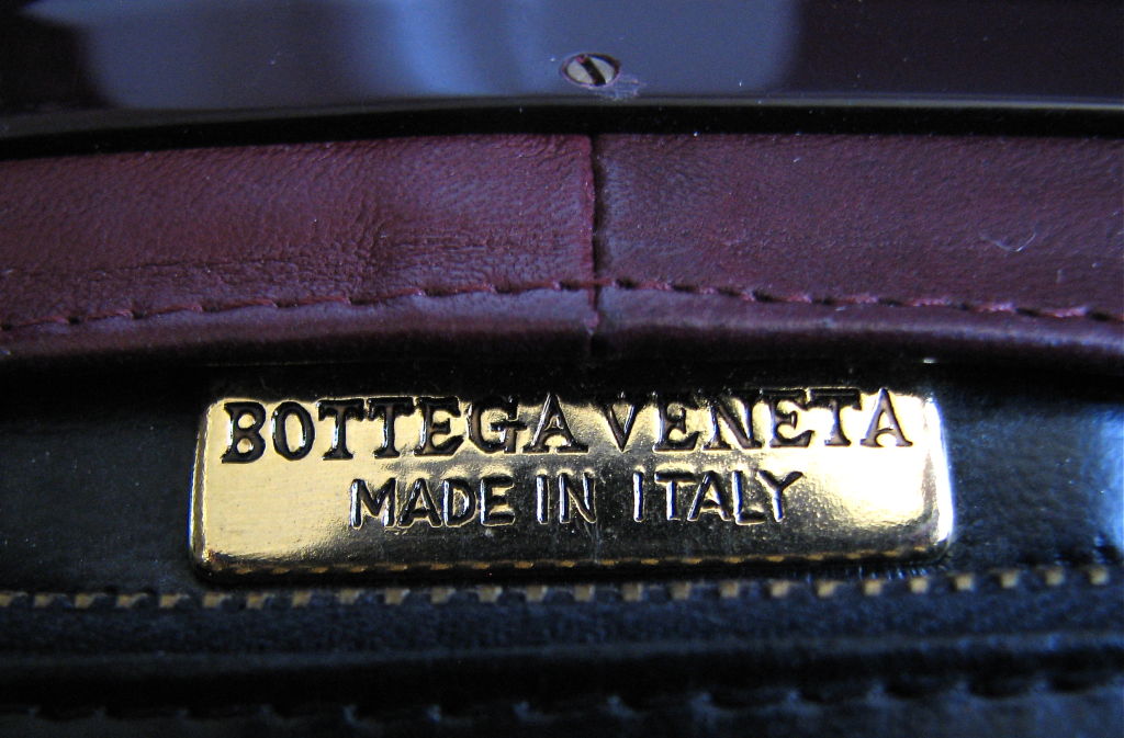 Women's BOTTEGA VENETA burgundy woven leather clutch with lucite frame