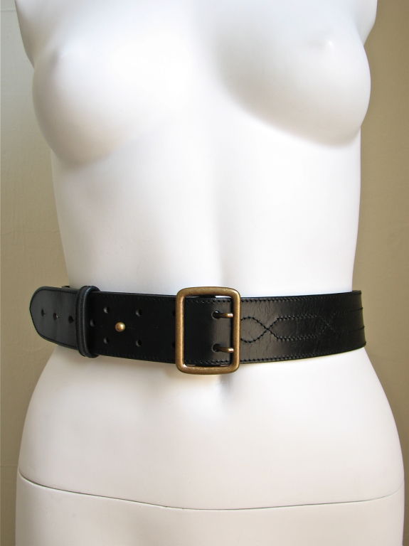 Versatile black belt from Alaia with ornate topstitching and unique brass buckle. Topstitching resembles a modified western belt. Made in France. Size 70. Never worn - excellent condition.
