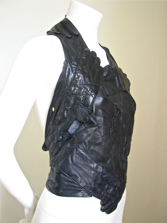 Stunning example of Margiela's artisanal line dating back to 2001. Top is made entirely of vintage kidskin gloves. Color is jet black. Leather is butter soft. Size is somewhat flexible due to the back being open. Made in France. Excellent condition.