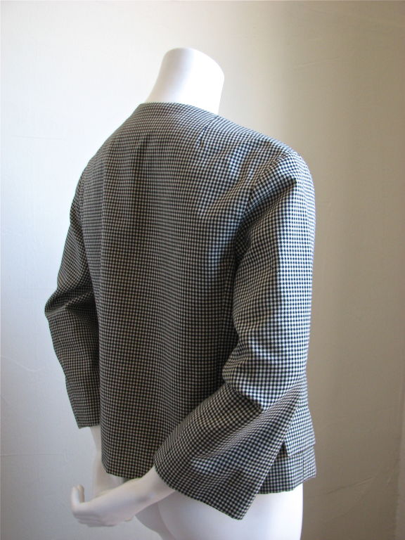 Beautiful, classic 60's houndstooth jacket made by Dior. Rounded collar. Hip pockets. Boxy fit. Slightly cropped bracelet length sleeves. Labeled UK size 12 (US 8) but is best suited for a US size 4-8. 15