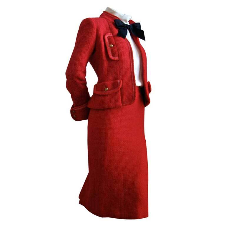 CHANEL red boucle wool suit with clover buttons