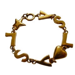 Vintage YVES SAINT LAURENT gilt 'YSL' bracelet