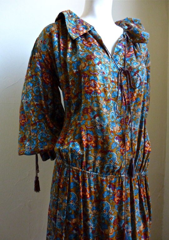 Very rare Yves Saint Laurent numbered couture peasant dress dating to the late 1970's. Made entirely of silk and accented with silk tassels at neck, waist and wrists. Very flexible with sizing due to the cut - this would fit a US size 6-10. Made in