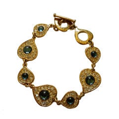 YVES SAINT LAURENT heart bracelet with poured glass 
rhinestone