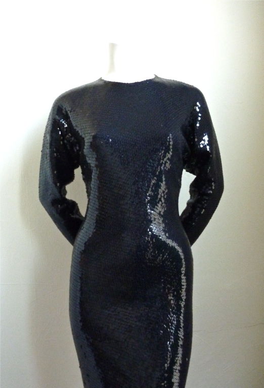 Breathtaking black sequined full length gown from Halston. Ca. 1975. Fits a US size 4-6. Very good condition (minimal sequin loss).