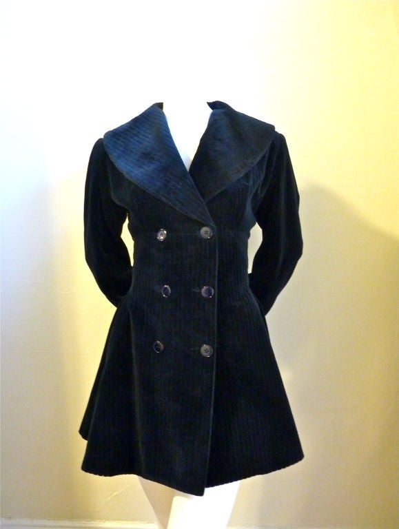 Incredibly shaped, corset jacket from Alaia. Ca. 1985. Softest corrugated velvet fabric! Double breasted with a shawl collar. Very fitted bodice. Hidden pockets at hips. Midnight blue. Fully lined. FR 38. EXCELLENT CONDITION