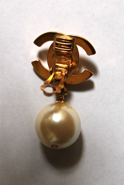 CHANEL gilt 'turn-lock' earings with pearls at 1stDibs