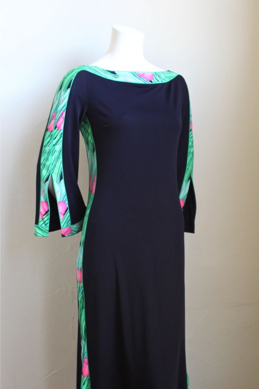 Stunning jersey dress with contrasting floral trim from Leonard Paris. Ca. 1970. Best suited for a small or medium. Zips up back. Made in France. Excellent condition.