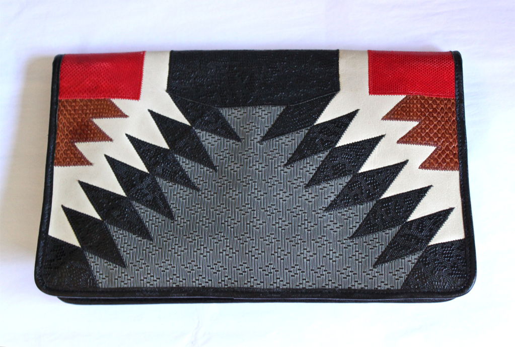 Bold textured leather clutch with snakeskin trim from Carlos Falchi. Ca. 1980. Very large size. Removable thin shoulder strap. Made in USA. Excellent condition.