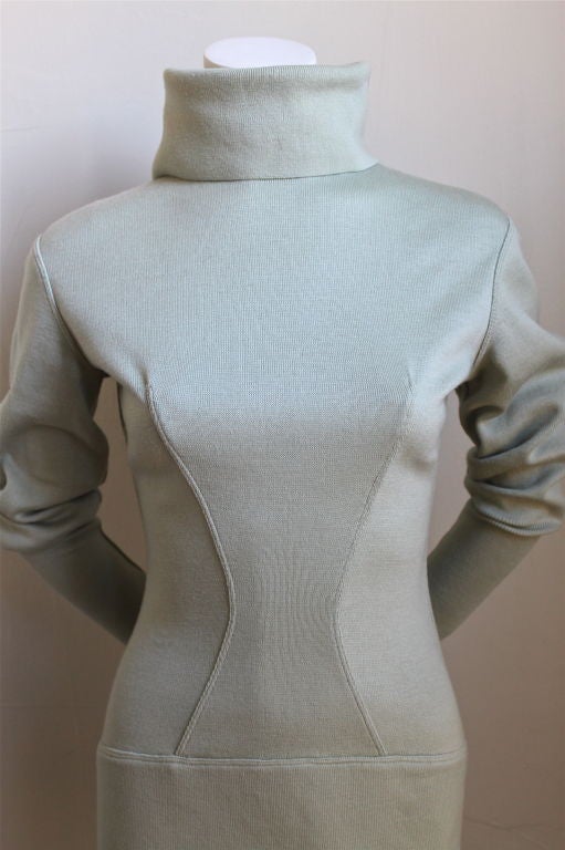 Beautiful pale mint dress from Azzedine Alaia. Ca. 1990. Dramatic fold over collar and puffed sleeves with flattering bodice and hip seams. Fits a small or Medium. Zips up center back.  Made in Italy. Excellent condition.