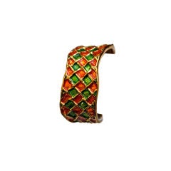 YVES SAINT LAURENT gilt asymmetrical cuff with enamel