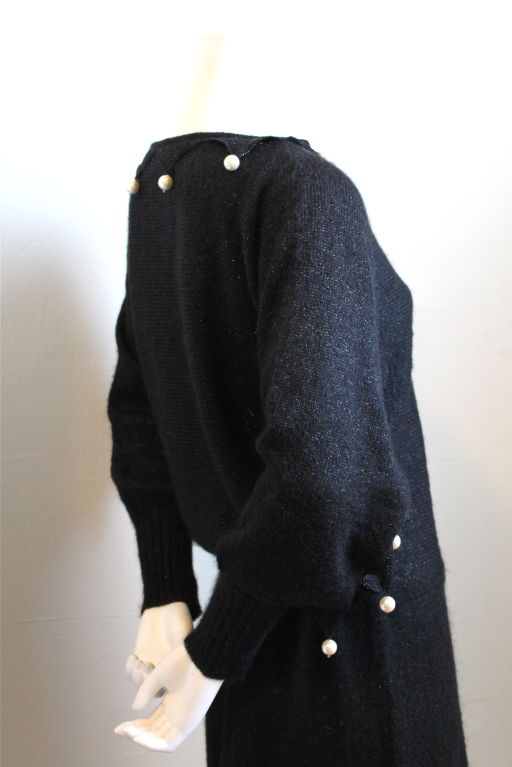 Black lurex knit dress with pearl trim from Loris Azzaro. Ca. 1975. Best suited for a small or medium. Made in Italy. Excellent condition.