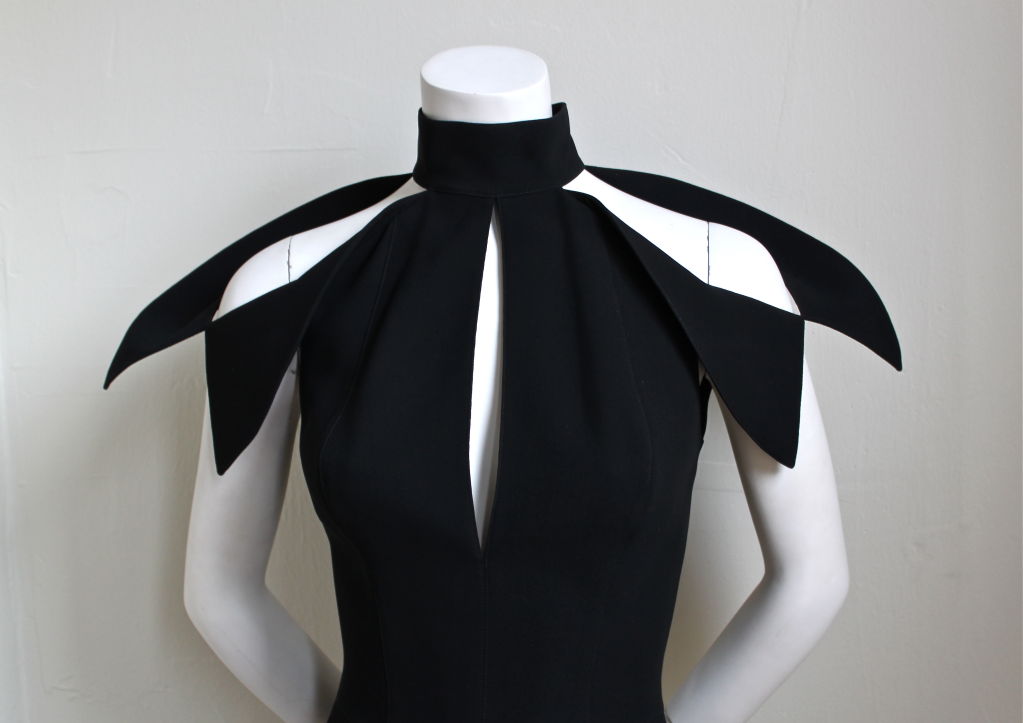 Very dramatic, sculpturally shaped, jet black dress from Thierry Mugler Couture from the 1990's. French size 38, although this dress runs small and fits a US 2 or 4. Zips up center back and secures at neckline with two snaps. Fully lined. Made in