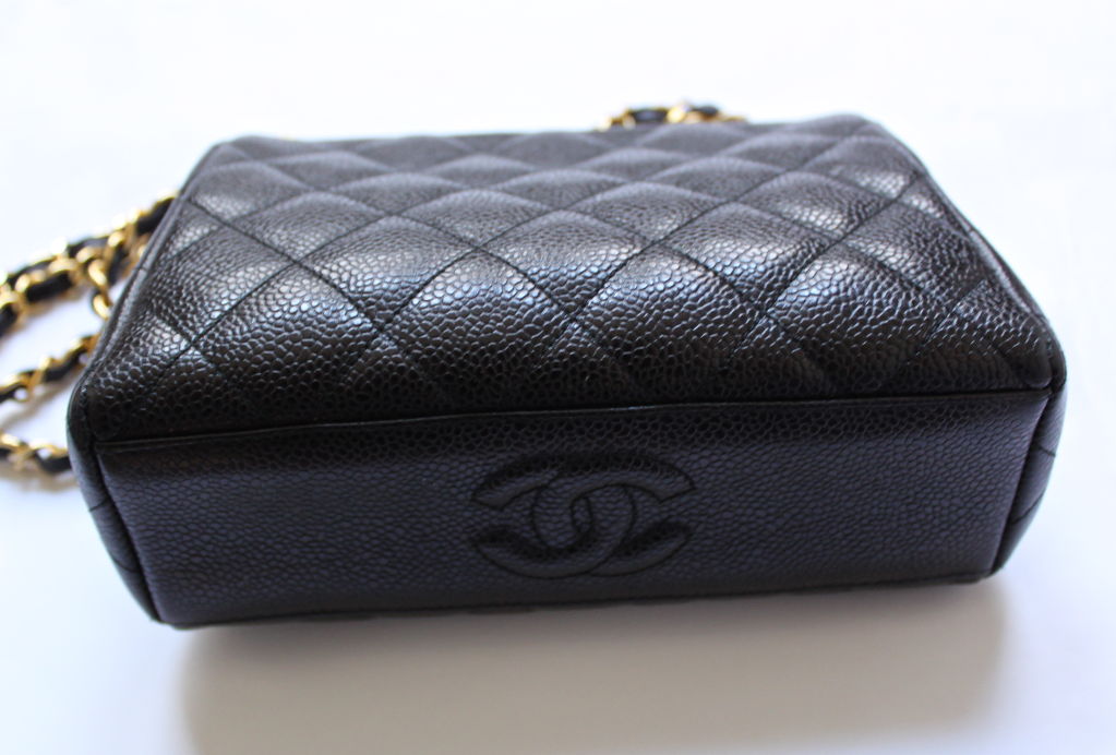 Black caviar leather 'frame' bag from Chanel. This bag dates to the late 1970's/ early 1980's. Measure 8