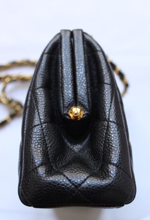 Women's CHANEL quited frame bag in black caviar leather with gilt chain