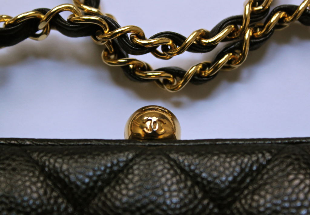 CHANEL quited frame bag in black caviar leather with gilt chain 1