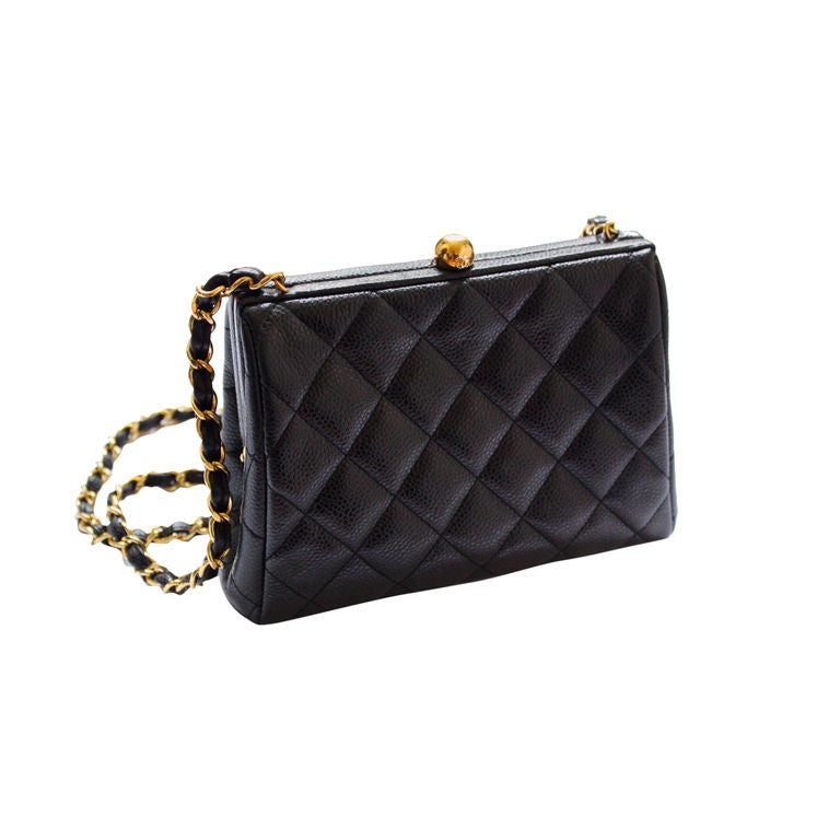 CHANEL quited frame bag in black caviar leather with gilt chain
