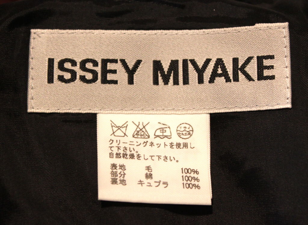 Women's ISSEY MIYAKE lightweight black jacket with open back & long ties