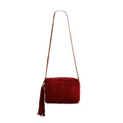 Vintage classic 1980's CHANEL red suede quilted bag with long tassel