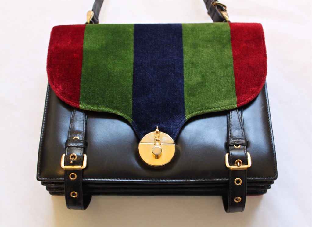 Very rare velvet and leather shoulder bag with gilt hardware from Roberta Di Camerino. Ca. 1970. Colors are rich burgundy, deep grass green and navy blue with jet black leather. Very roomy sized bag. One interior zippered pocket with additional