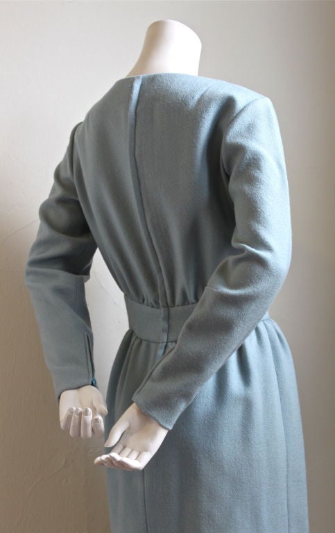Powder blue wool day dress with flattering set in waistband from Teal Traina dating to the early 1960's.  Fits a US 4-6. Fully lined. Zips up center back and at wrists. Excellent condition.