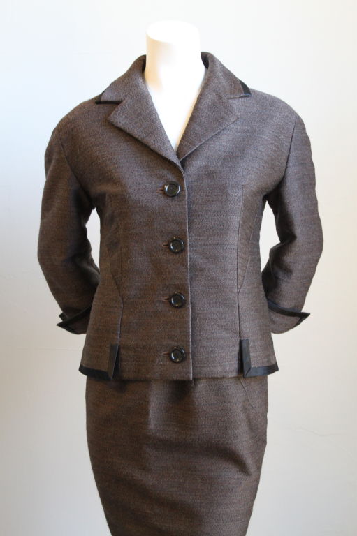 Haute Couture black and brown textured wool and silk suit from Balenciaga dating to the very early 1960s. The quality is impeccable -- it is everything you would expect from a couture garment. Made in France. Fits a US 6-10. Excellent condition.